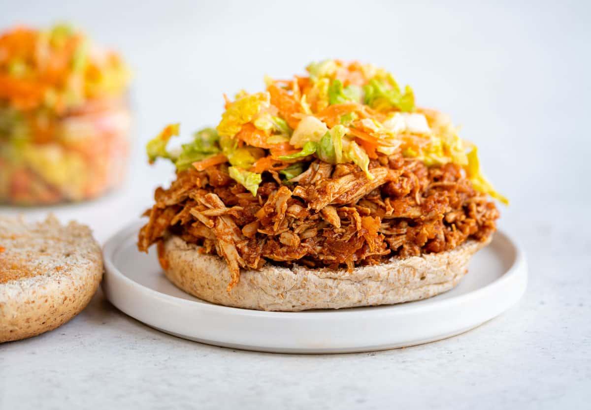 pulled chicken served on a bun with coleslaw