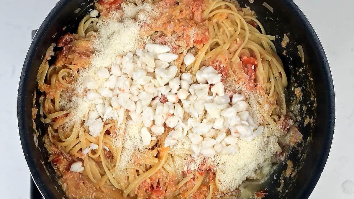 Preparing crab pasta in a pan