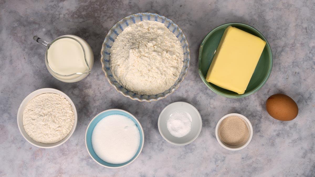 Ingredients for Danish pastry dough: flour, butter, milk, sugar, yeast, salt and an egg