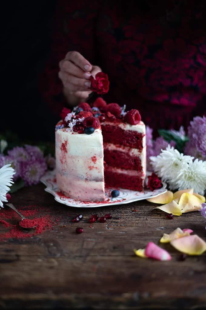 Red velvet layer cake with a slice taken out