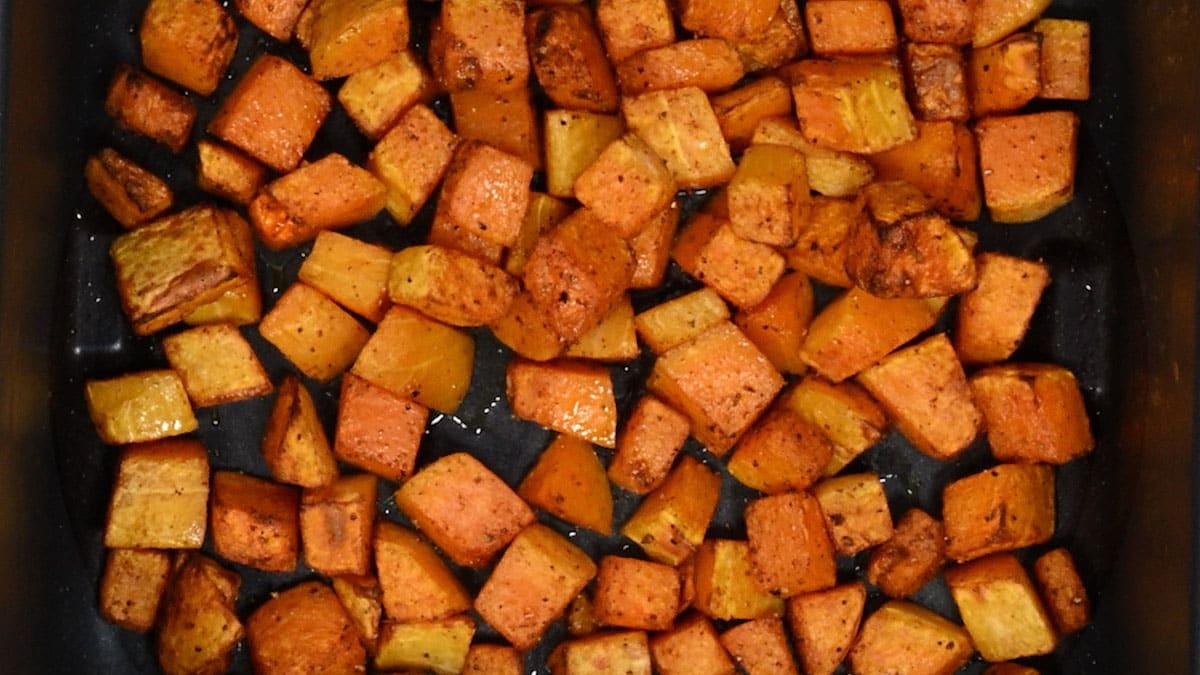 roasted butternut squash in an air fryer basket