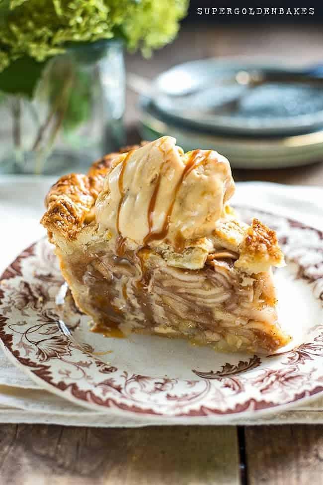slice of apple pie topped with vanilla ice cream and drizzled with salted caramel