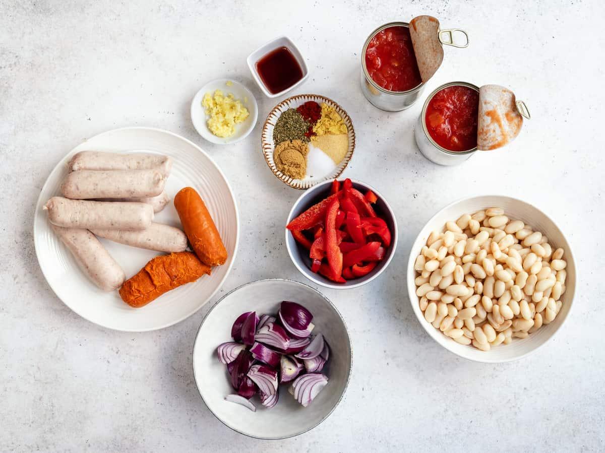 sausage caserole ingredinets laid out on a white background