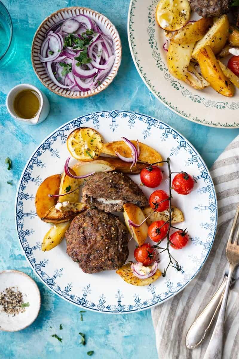 Greek bifteki with potatoes and tomatoes