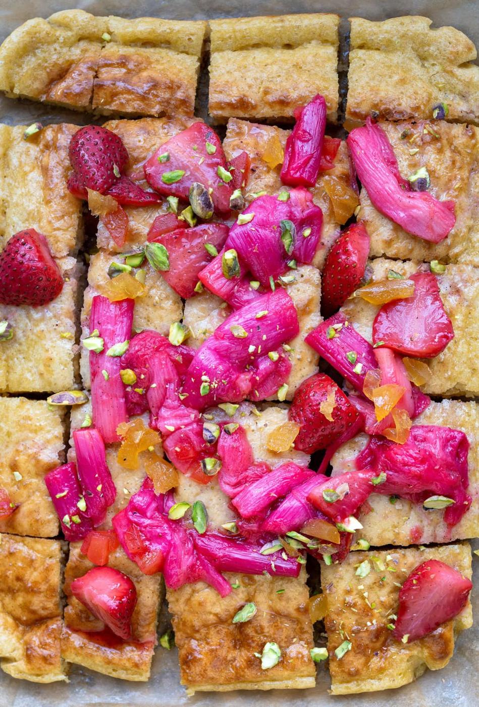 close up on sliced sheet pan pancakes topped with roasted fruit