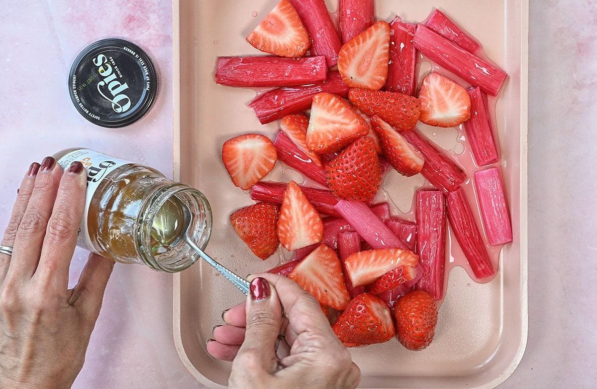 making roasted strawberries and rhubarb with ginger