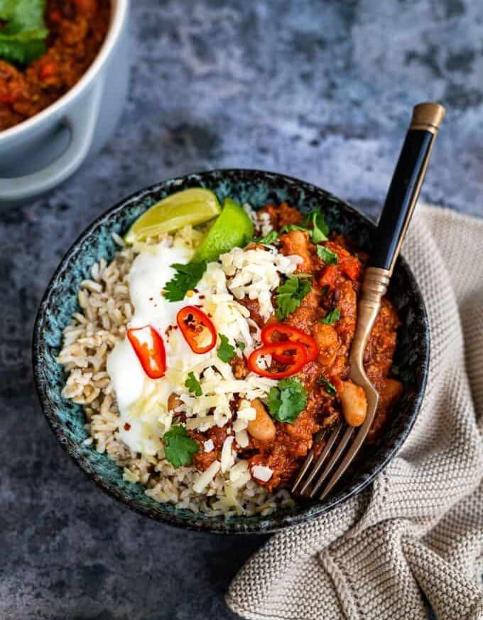 Overhead shot of bowl with chilli served over rice