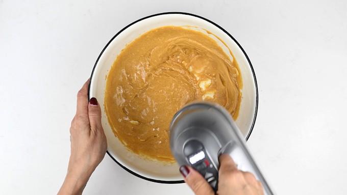 Whisking egg yolks and sweetener to make a Slimming World cake