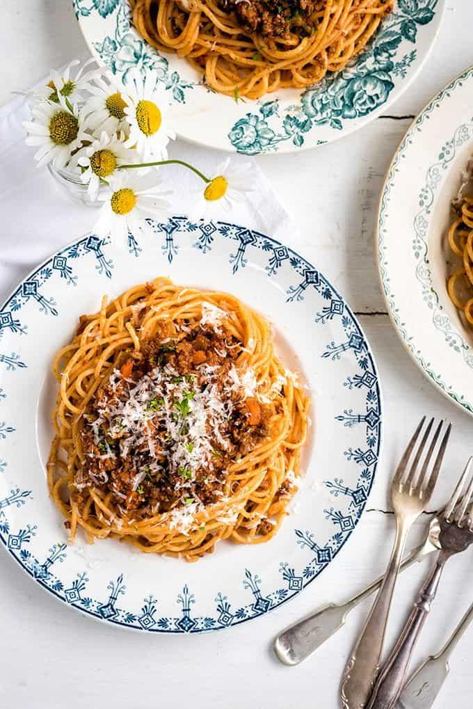 three servings of spaghetti Bolognese