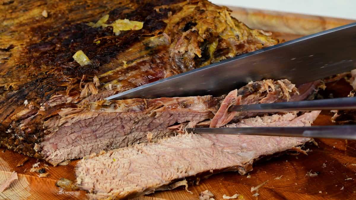 Slicing brisket on a cutting board