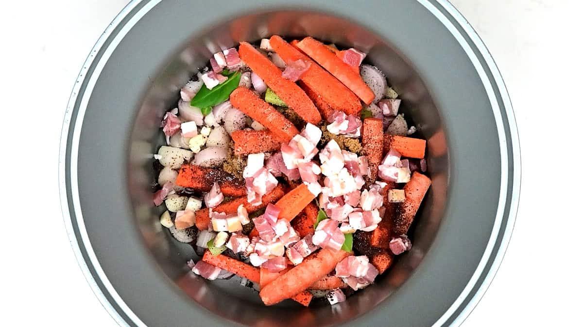 Ingredients for beef carbonnade in a slow cooker
