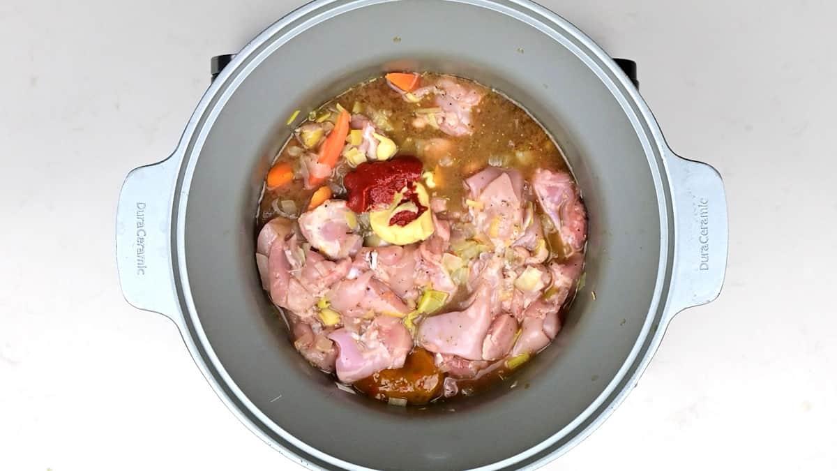 Ingredients for chicken stew in a slow cooker