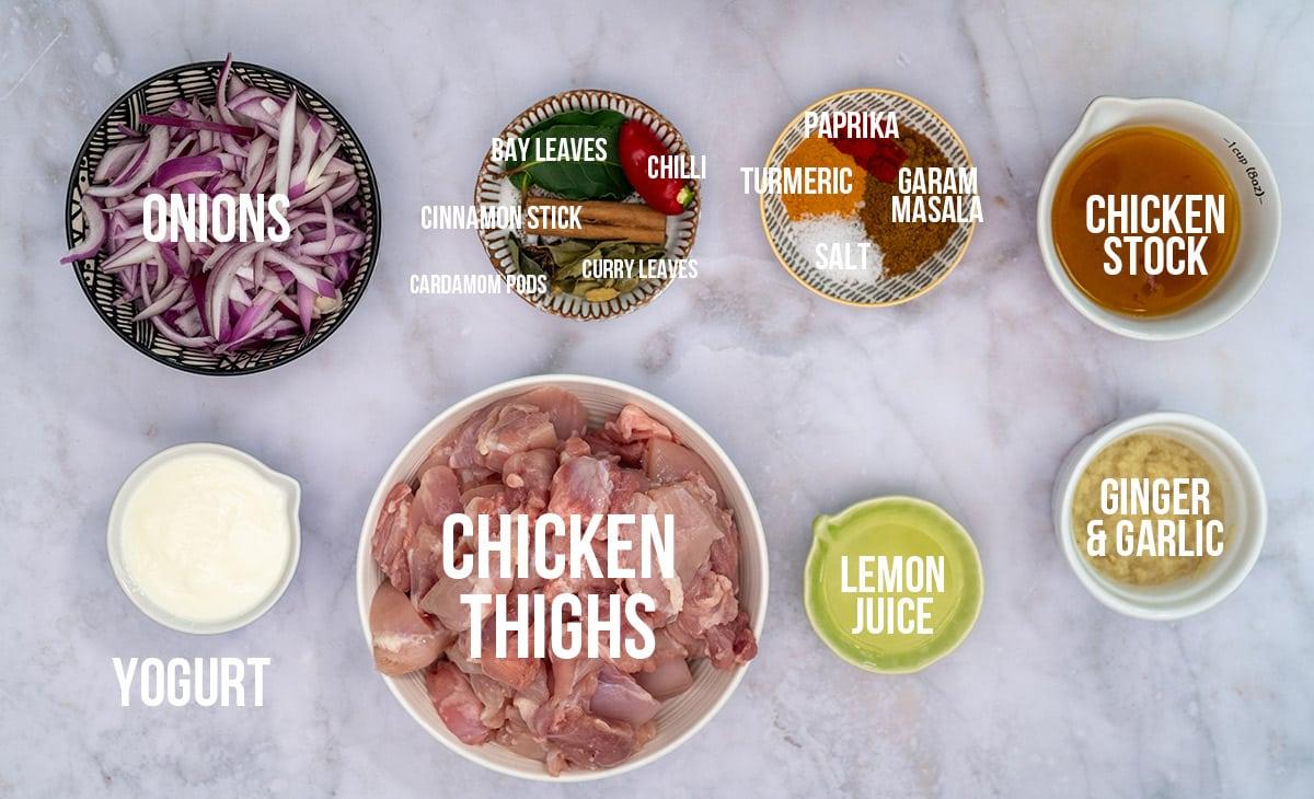 Ingredients for chicken biryani in various bowls with captions
