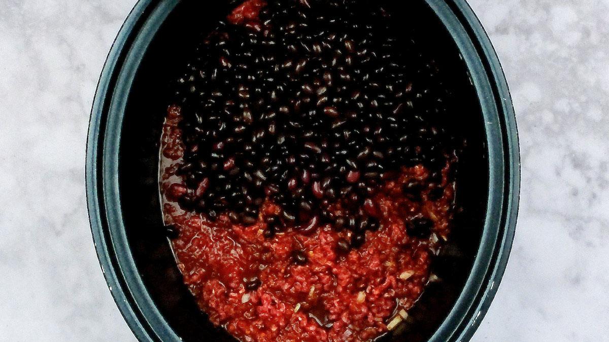raw ingredients for chilli con carne in a slow cooker