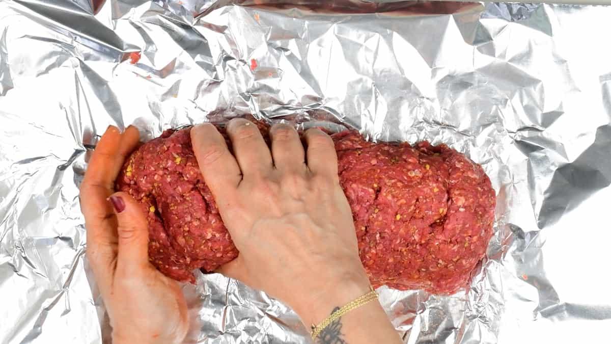 Forming beef Doner meat into a log shape