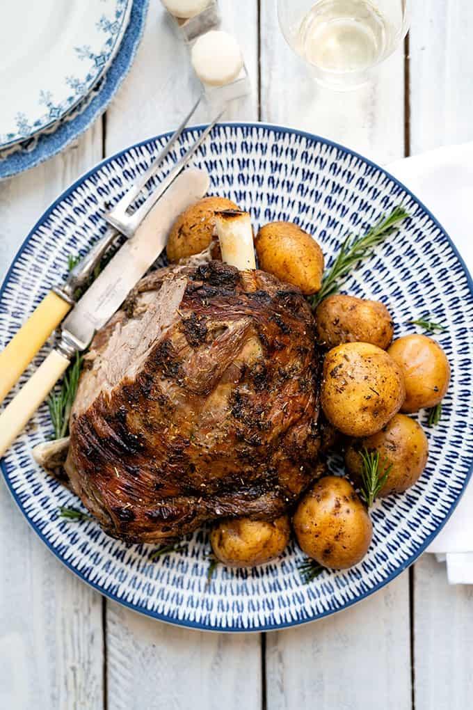 Platter of Greek roast lamb kleftiko with potatoes and rosemary