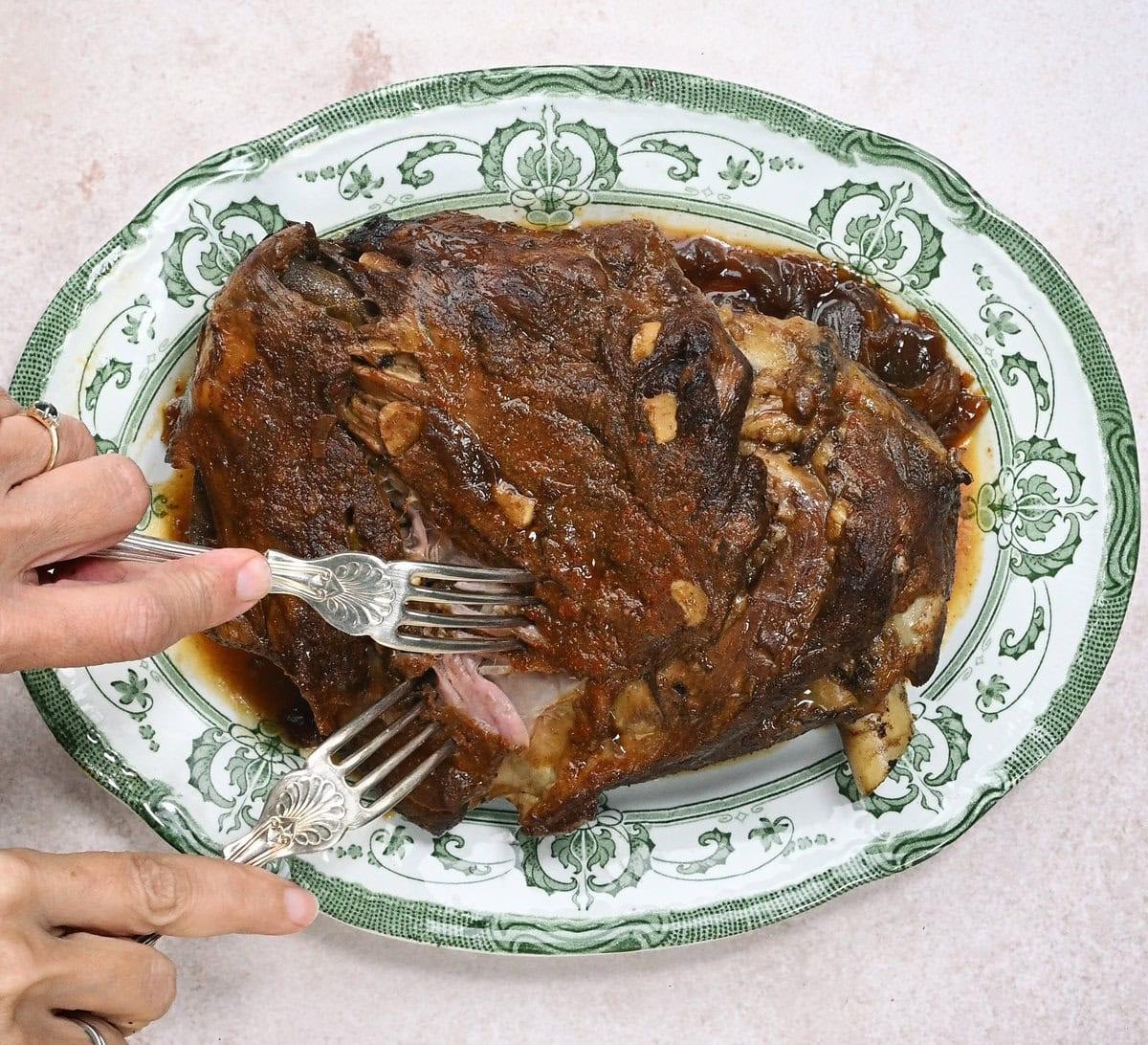 shredding slow cooked lamb
