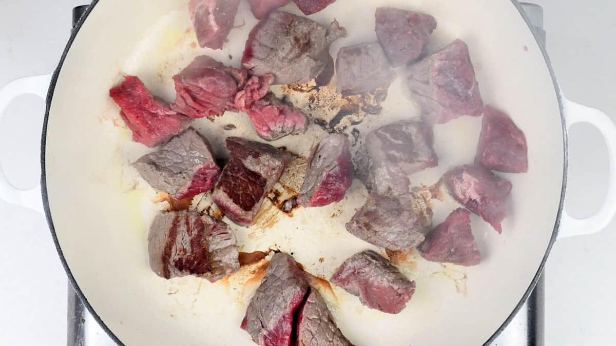 browning beef in a casserole