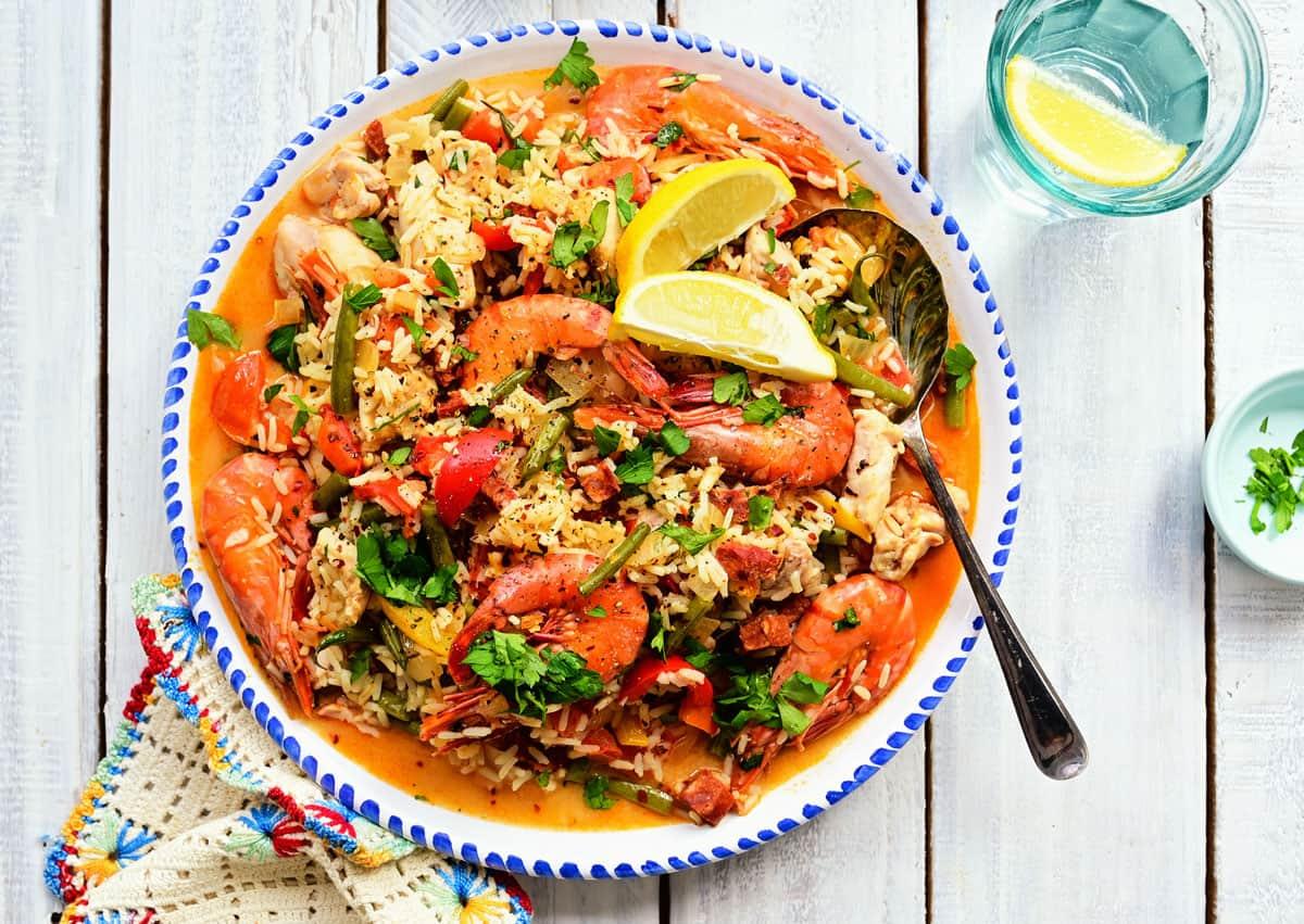 Platter with mixed paella containing chorizo, chicken and shrimp