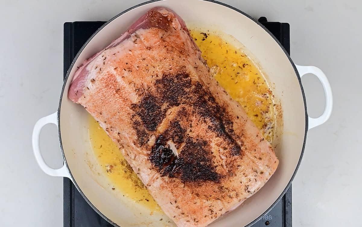 Searing pork loin in a skillet