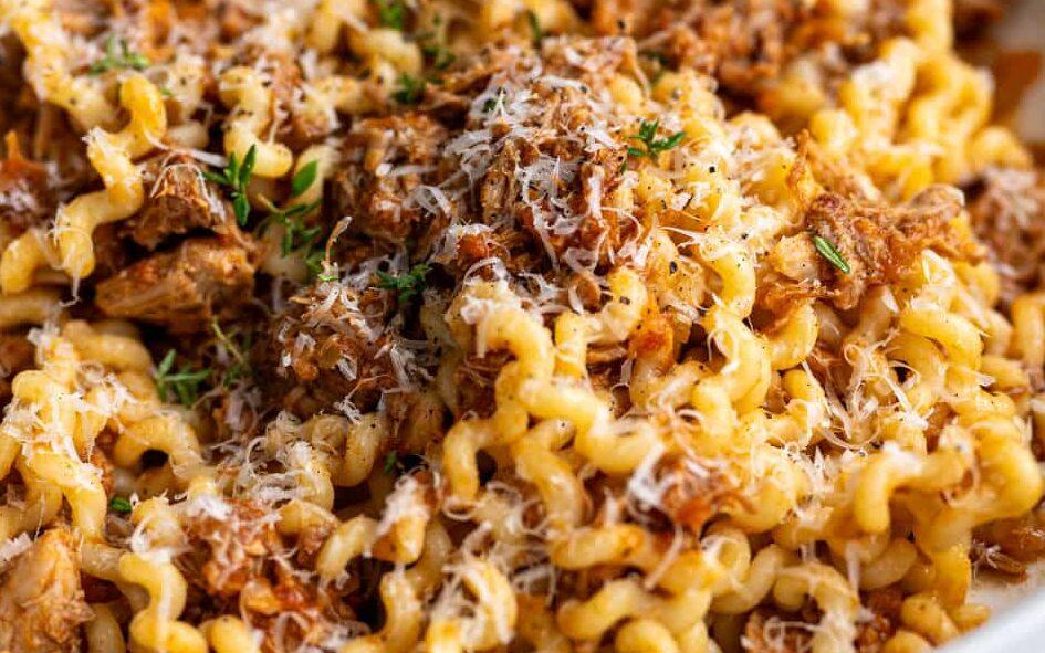 Slow cooker pork ragu served over fusili pasta