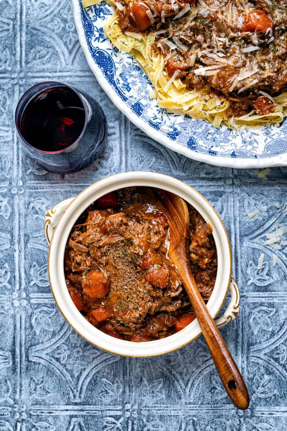 overhead view of beef pot roast in a ceramic bowl