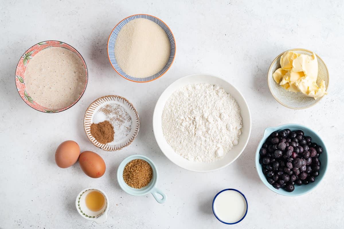 Ingredients for blueberry coffee cake measured in bowls