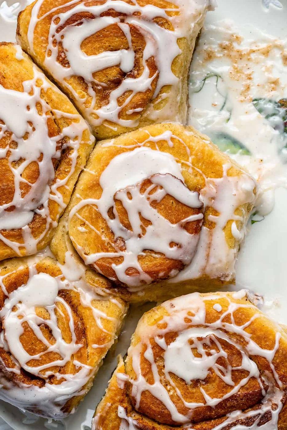 Sourdough cinnamon rolls drizzled with sugar glaze