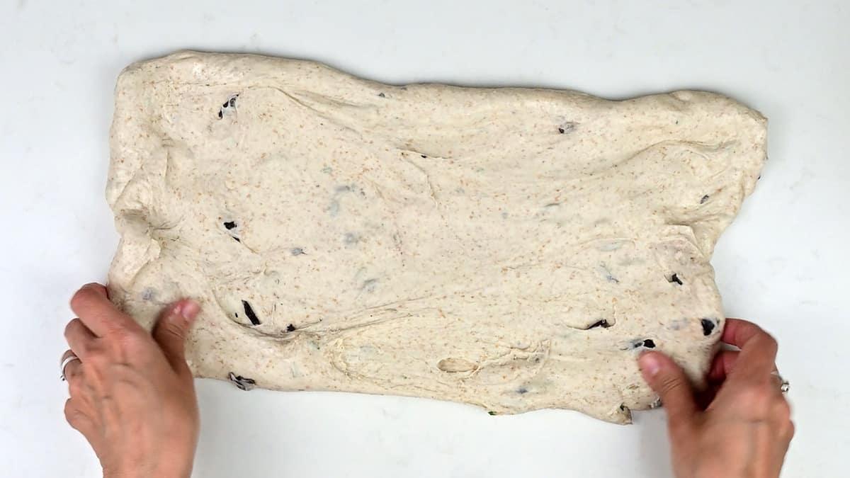 stretching bread dough to a rectangular shape
