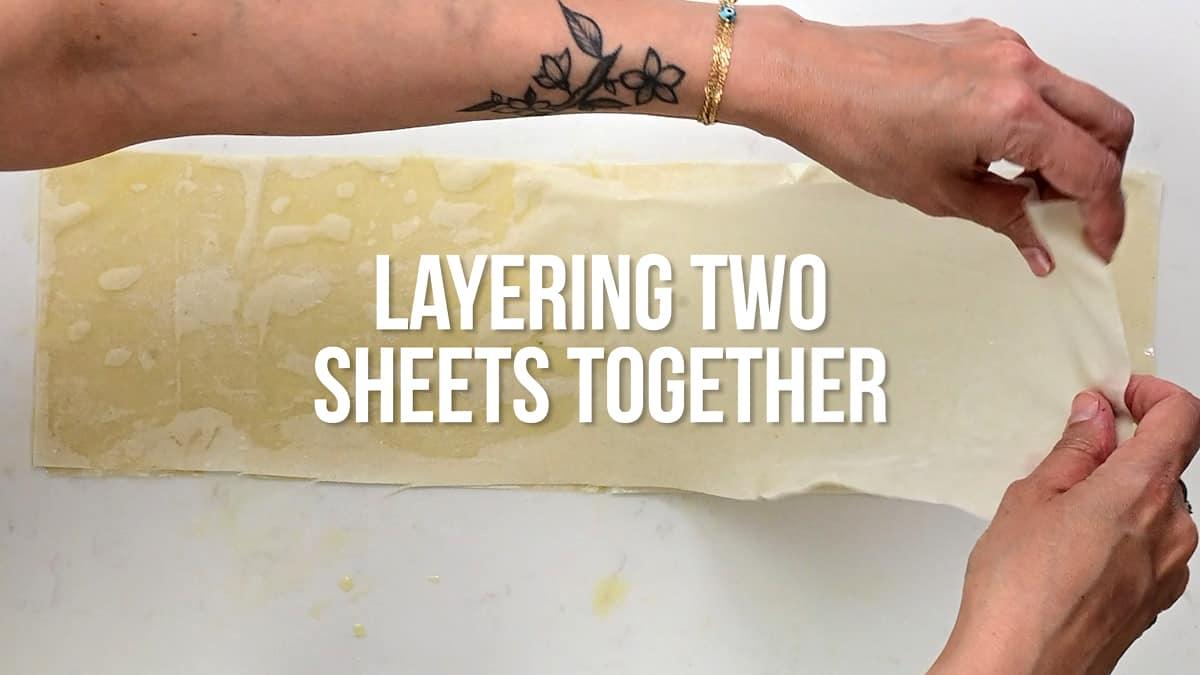 layering two strips of phyllo pastry together