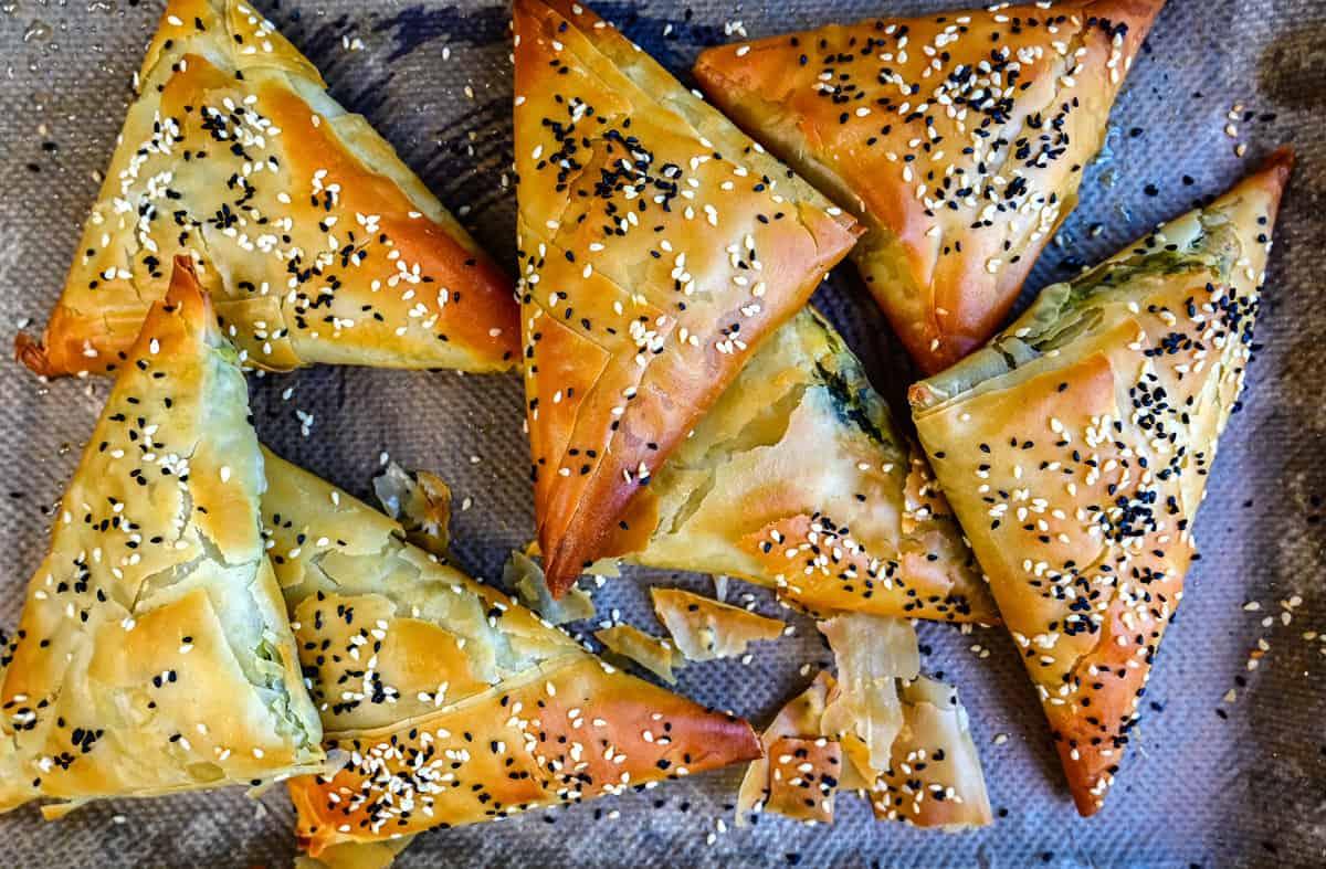 close up on greek spinach pies (spanakopitakia)