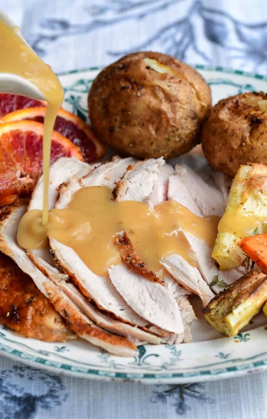 sliced turkey with gravy drizzle