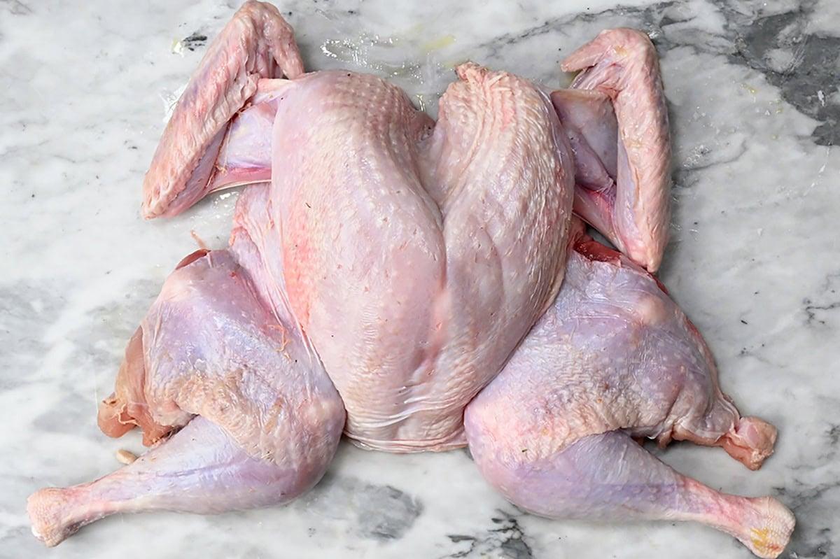 spatchcock turkey on a marble board