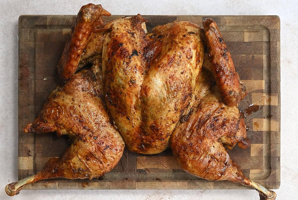roast spatchcock turkey on a wooden board
