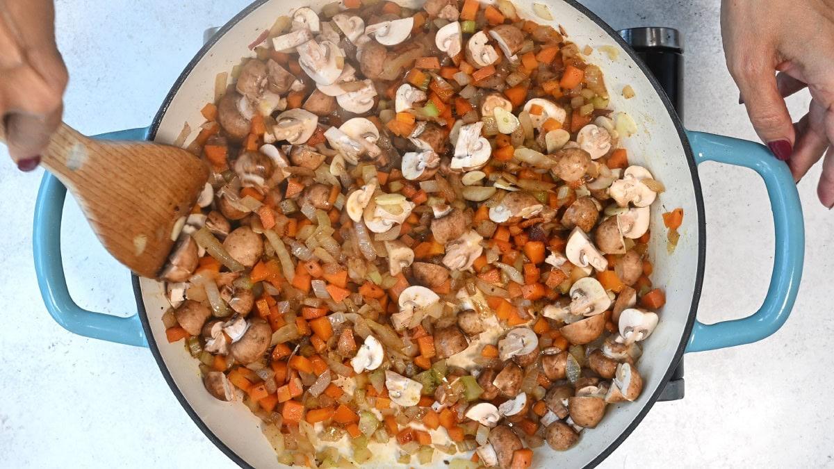 soffrito and mushrooms cooking in a pan