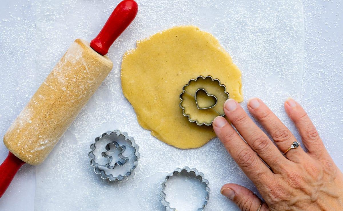cutting out linzer cookies