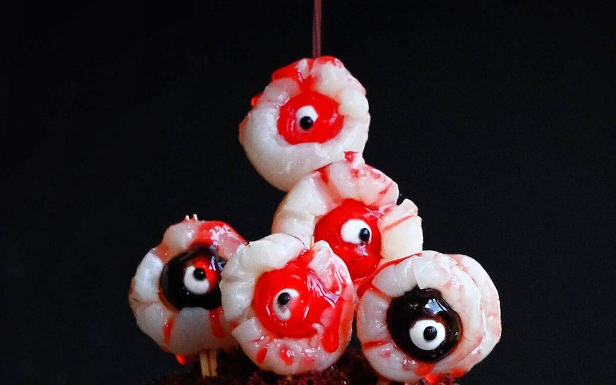 drizzling Halloween cake with edible blood
