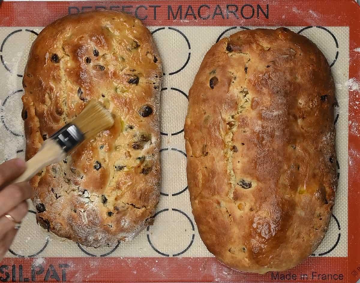 brushing christmas Stollen with melted butter