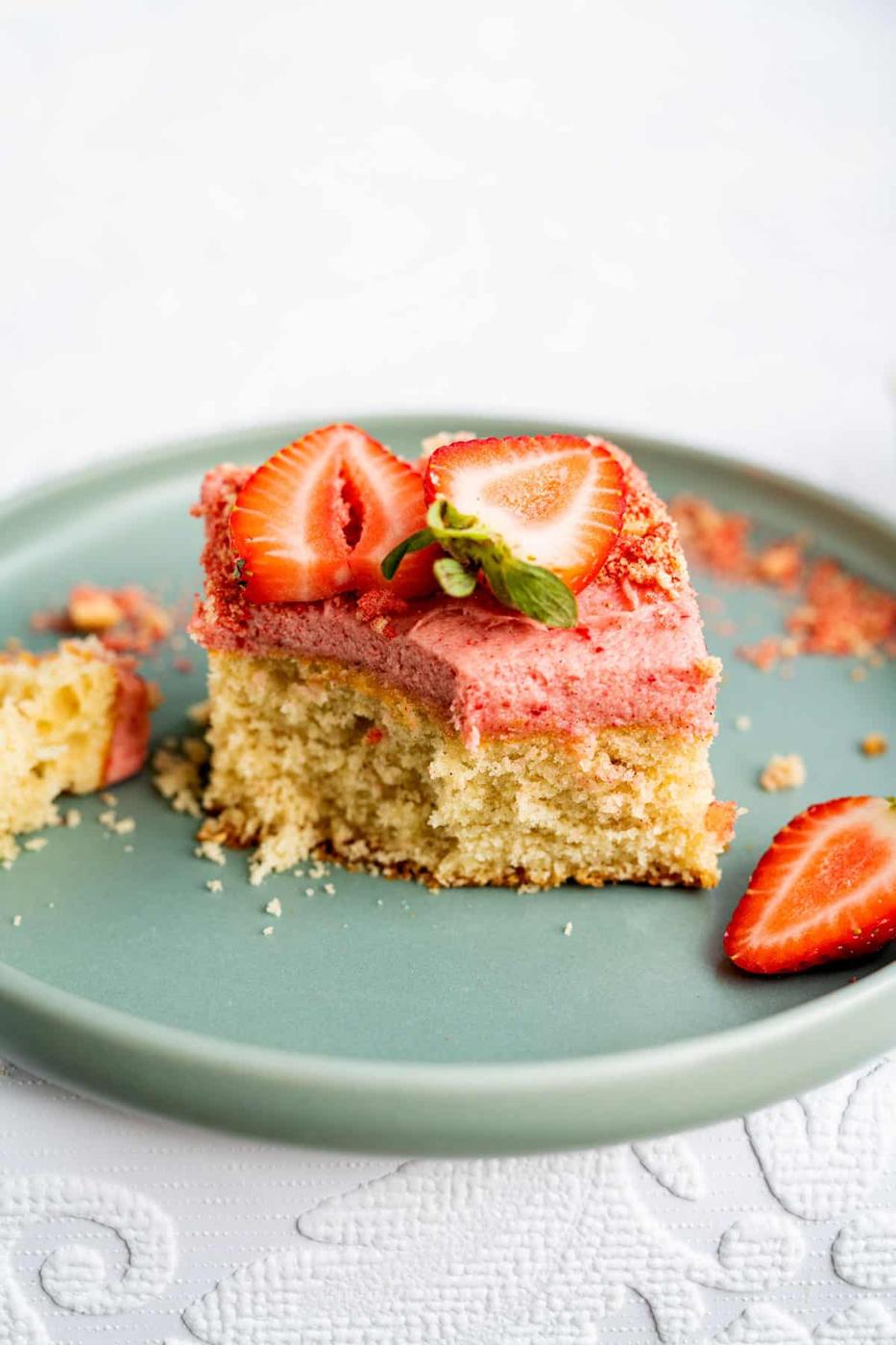 slice of strawberry cake with bite taken out