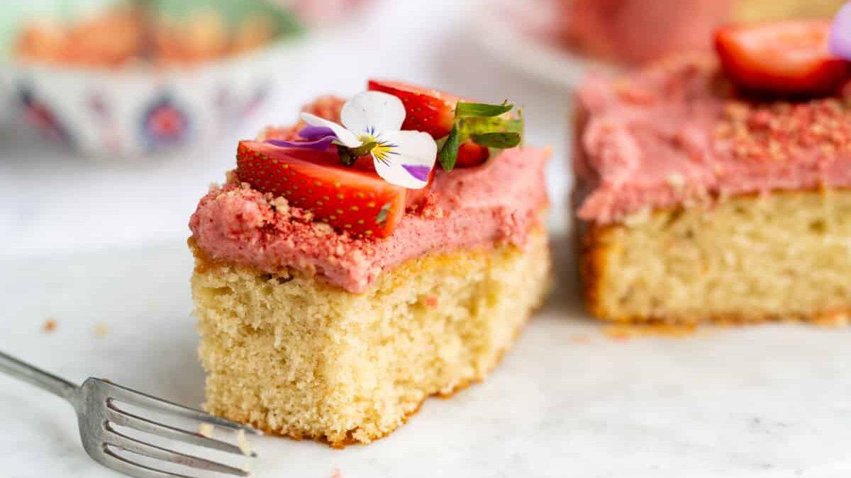 fresh strawberry traybake cake, sliced