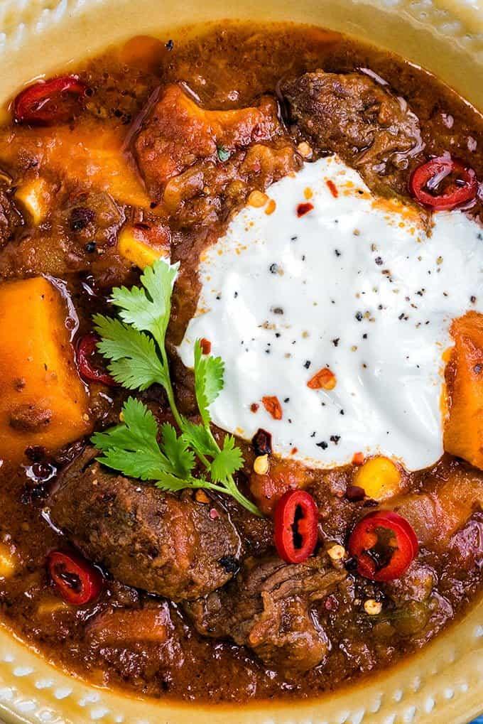 This delicious Tex-Mex beef stew with sweet potatoes is perfect whatever the season! Serve over rice with sour cream and lime wedges on the side.