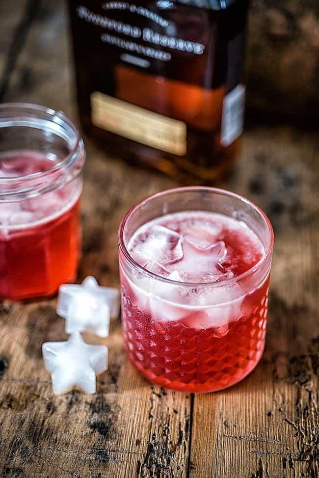 Rocks glass with bourbon drink served on the rocks