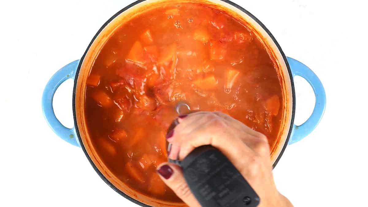 Blending tomato soup with an immersion blender