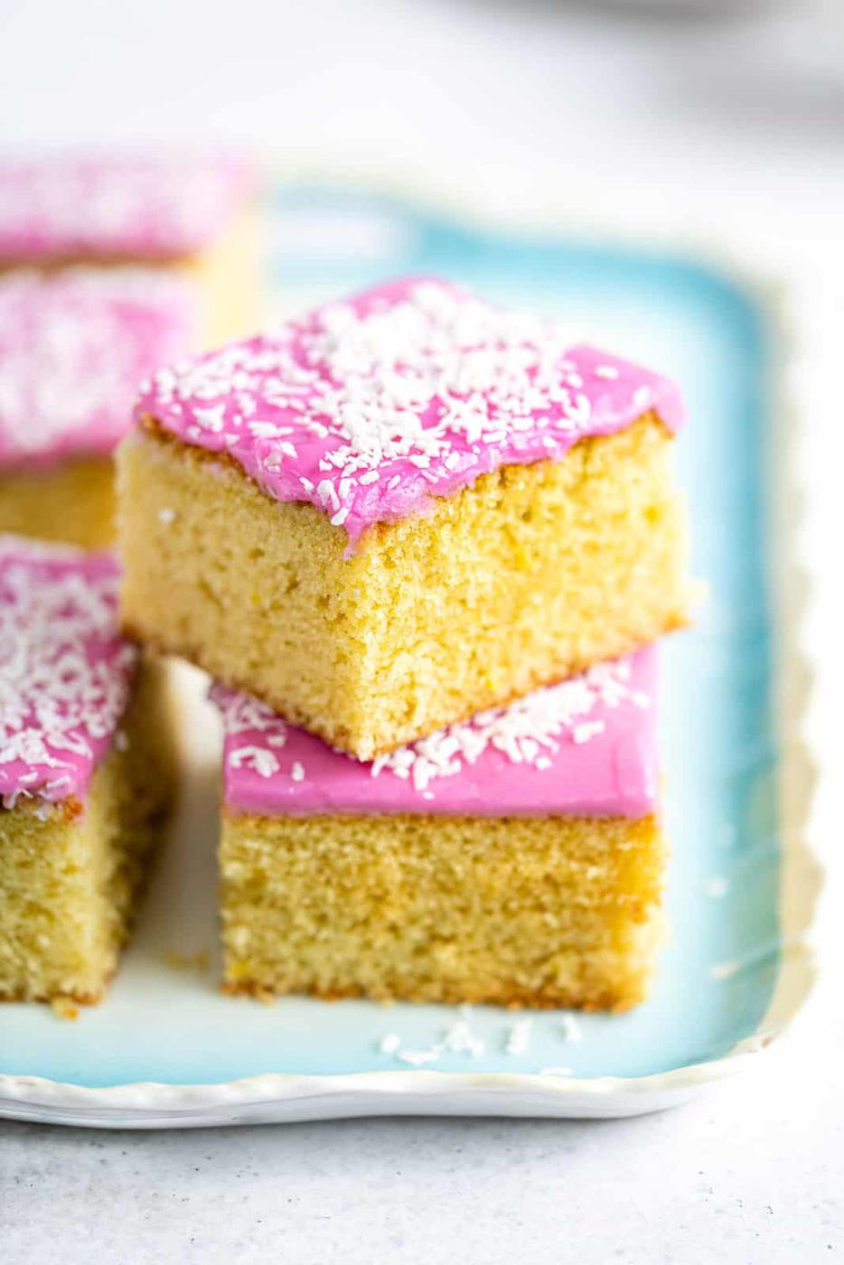 Slices of Tottenham cake stacked on a ceramic tray