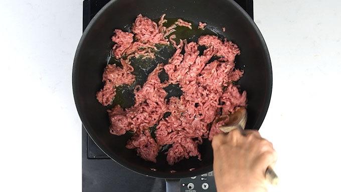 Browning ground lamb in a pan for Shepherd's Pie