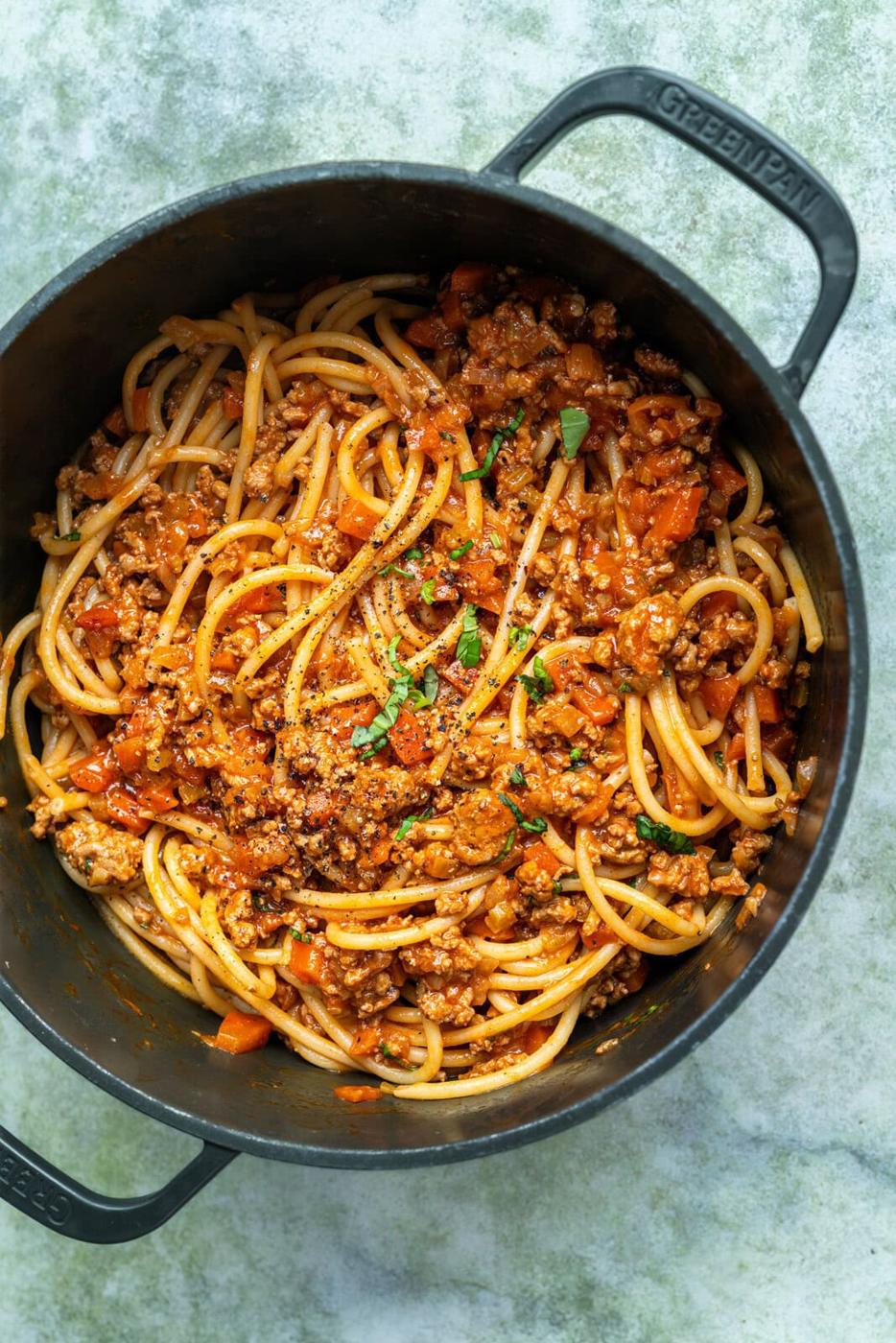 Pot of pasta tossed with turkey bolognese sauce