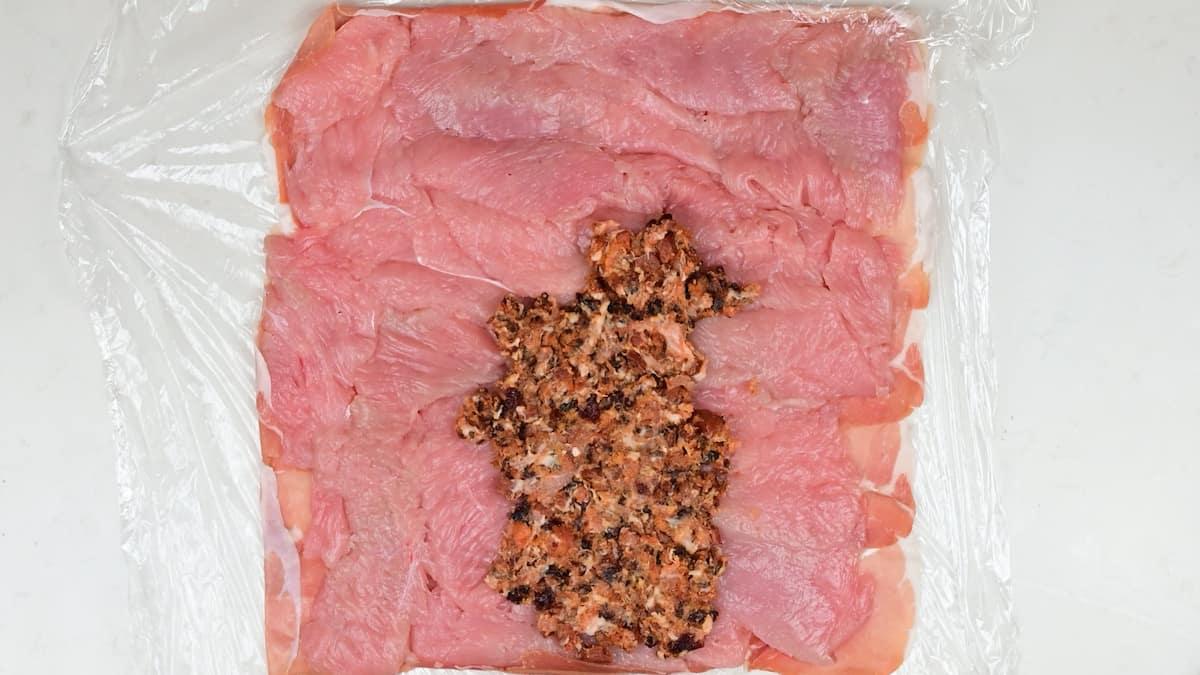 adding stuffing to a turkey roll