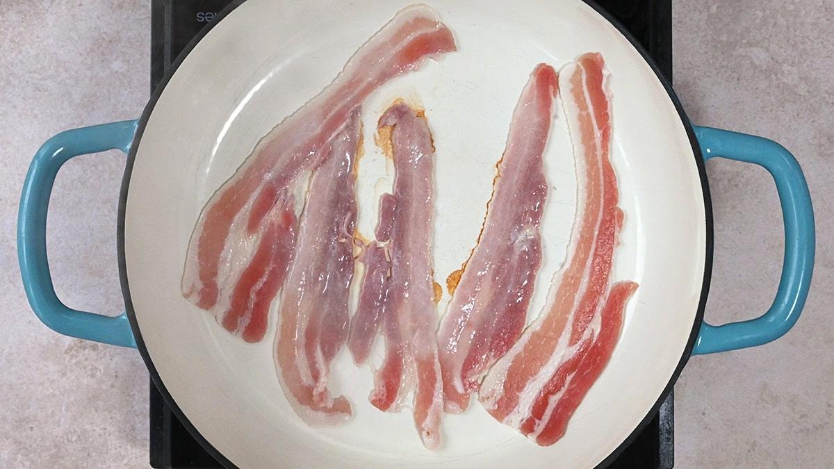 cooking streaky bacon in a pan