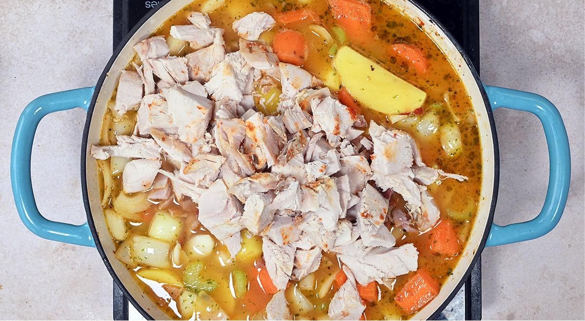 turkey stew being prepared in a casserole