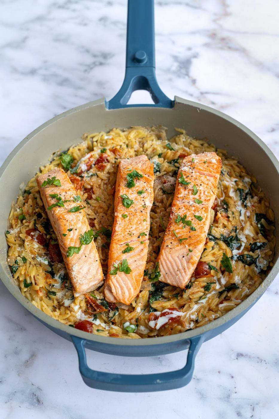 Tuscan Salmon Pasta with orzo, sundried tomatoes and spinach in a creamy garlic parmesan sauce